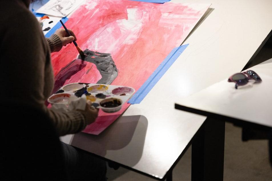 Students paint using acrylics in the studio during the course called 