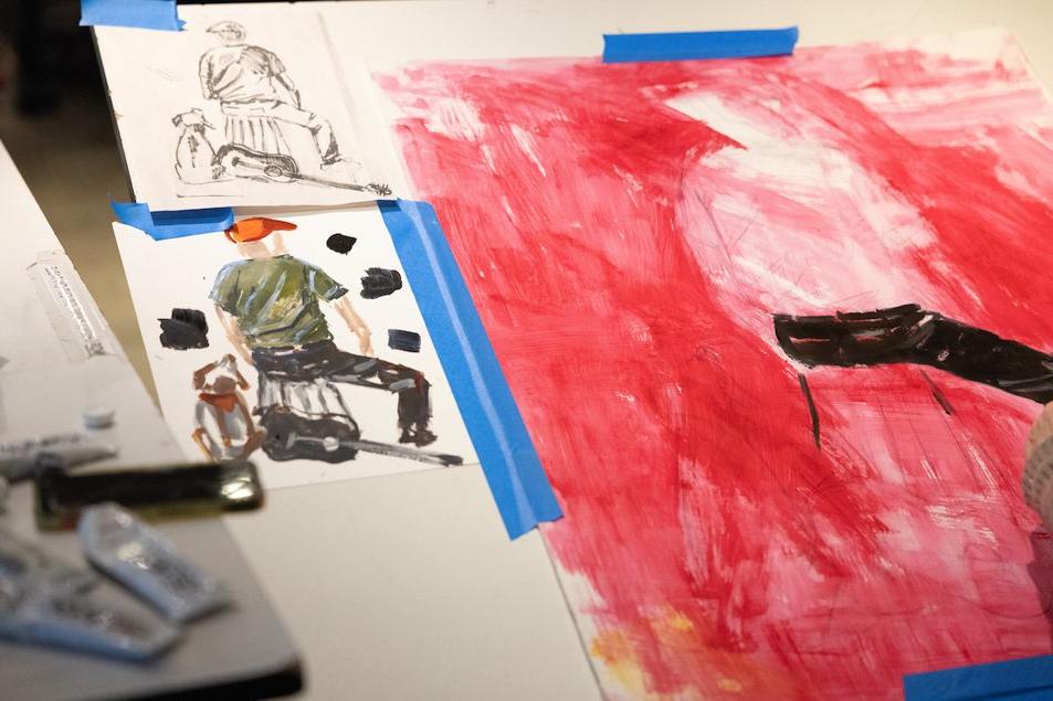 Students work with mixed media in the studio during the course called 